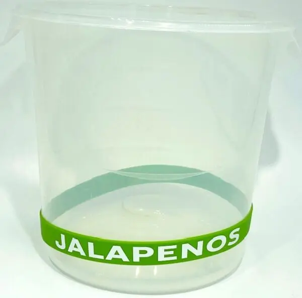 A plastic container with jalapenos written on it.