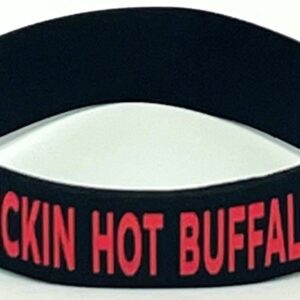 A black wristband with red lettering on it.