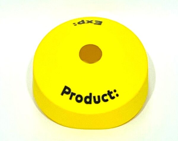 A yellow product marker sitting on top of a table.