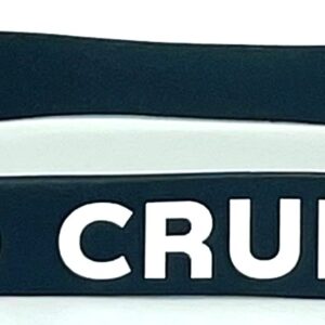 A close up of two bracelets with the word crud written on them