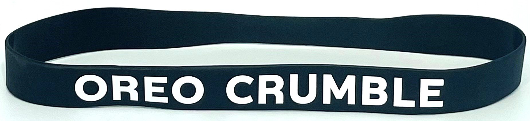 A close up of two bracelets with the word crud written on them