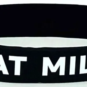 A black and white wristband with the words " eat milk ".