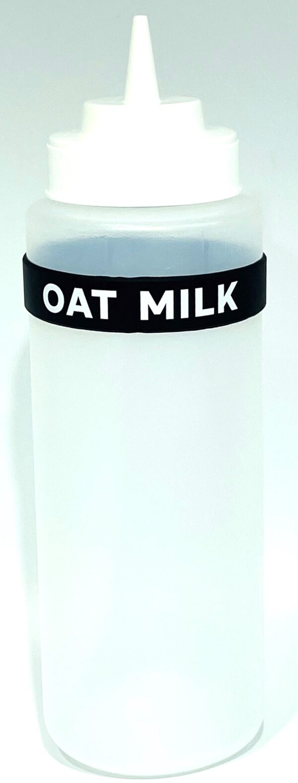 A close up of an oat milk bottle