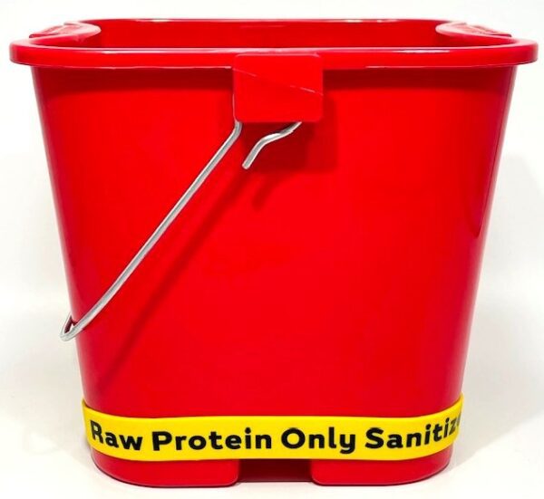 A red bucket with the words raw protein only sanitizer written on it.