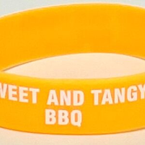 A yellow bracelet with the words " sweet and tangy bbq ".