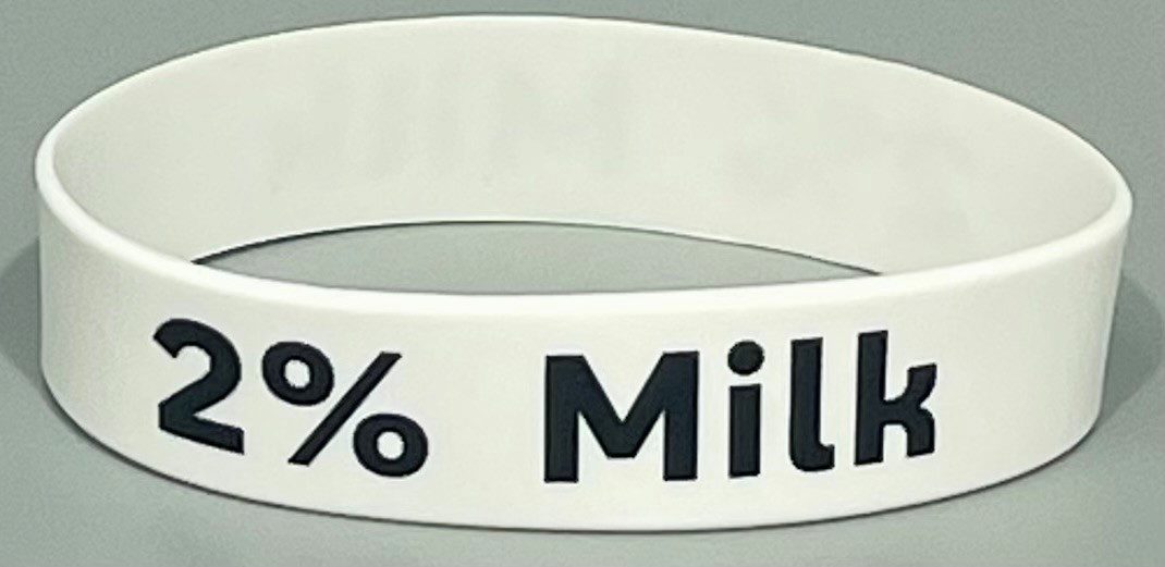 A white wristband with the words " 1 0 0 % million dollars ".