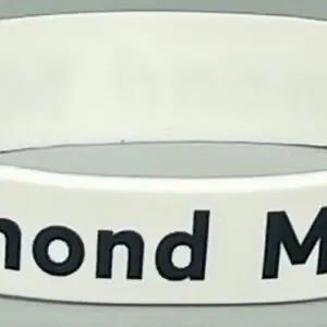 A white wristband with the words " diamond mine ".