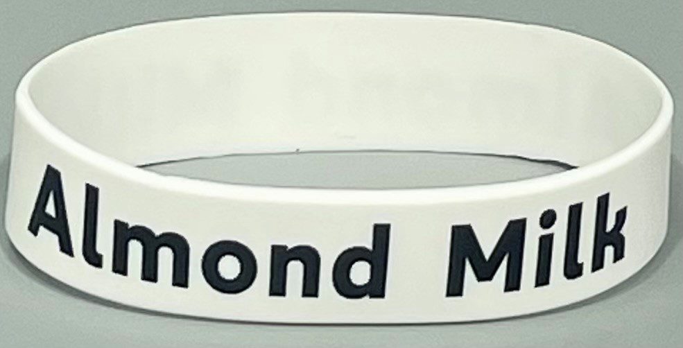 A white wristband with the words " diamond mine ".