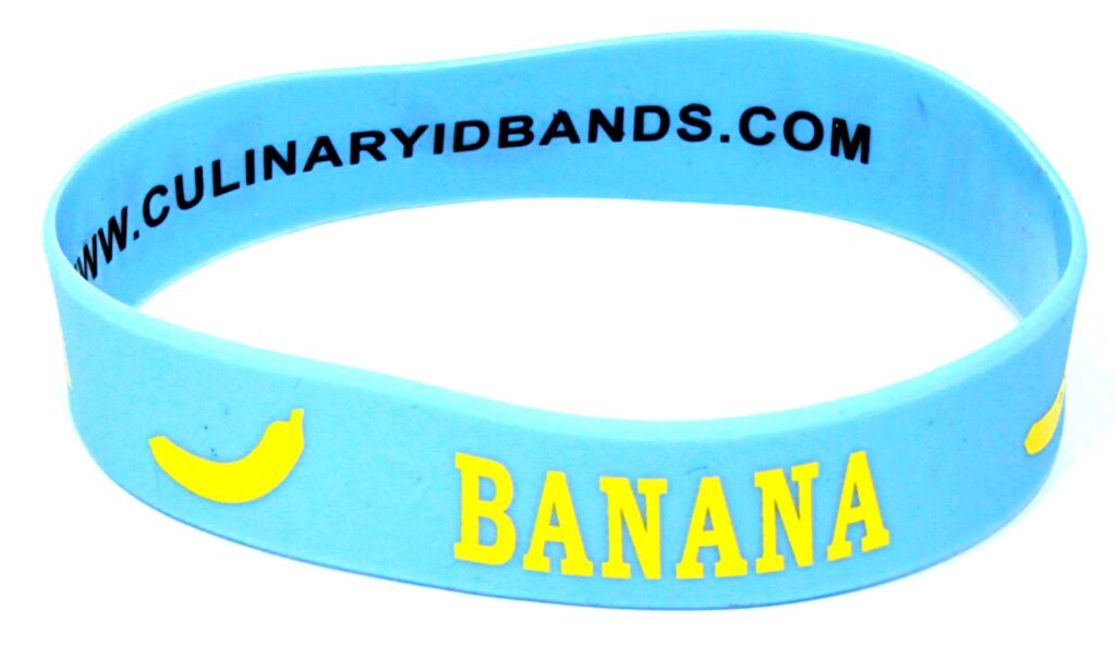 A blue wristband with the word banana on it.