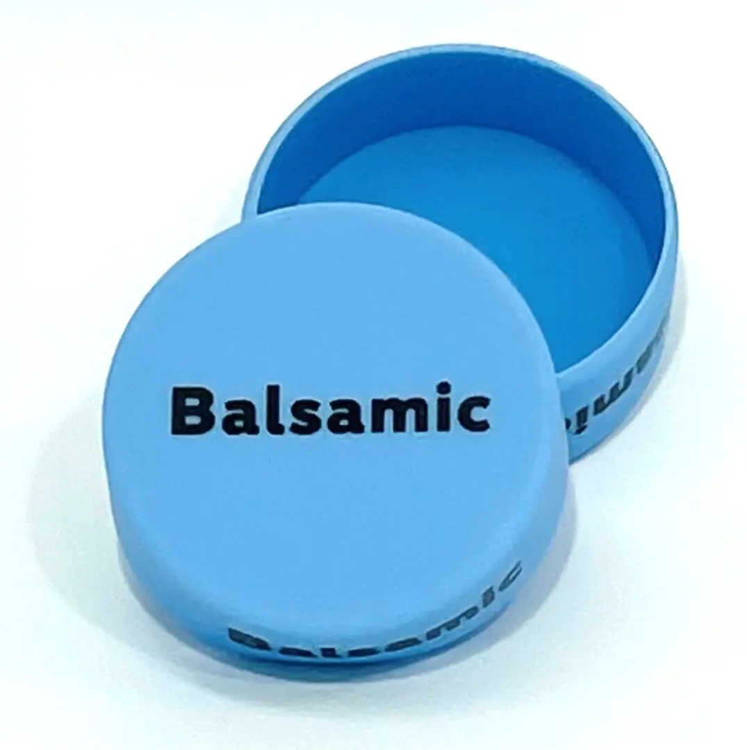 A blue container with the word balsamic on it.