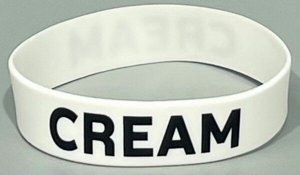 A white bracelet with the word scream written on it.