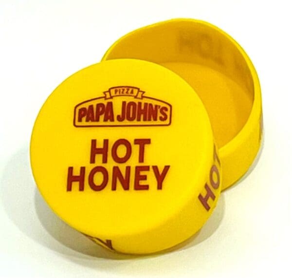 A yellow box with the words papa john 's hot honey on it.