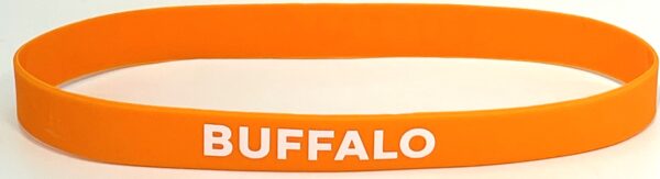 A close up of an orange wristband with the word buffalo on it