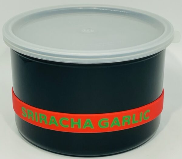 A black container with a red band around it.