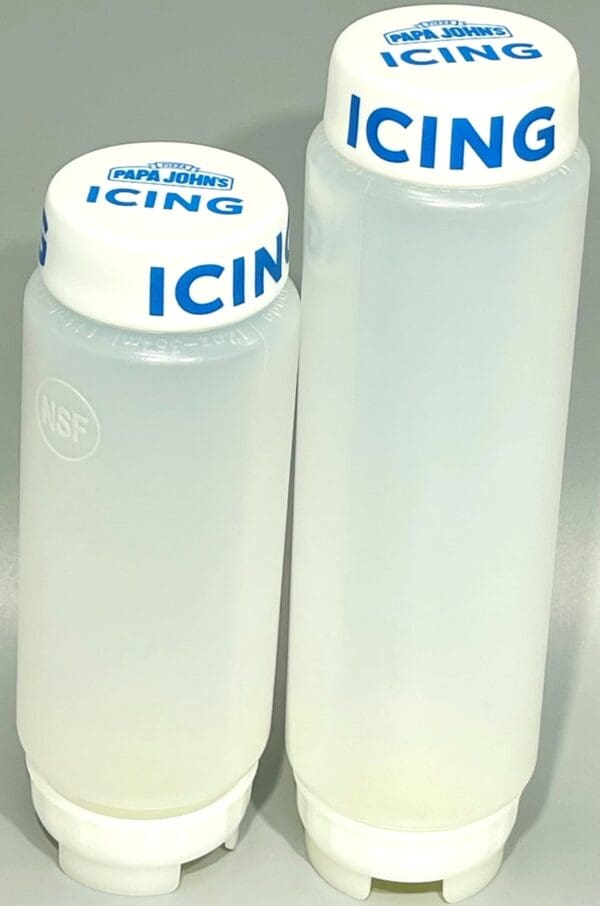 Two plastic containers with icing written on them.