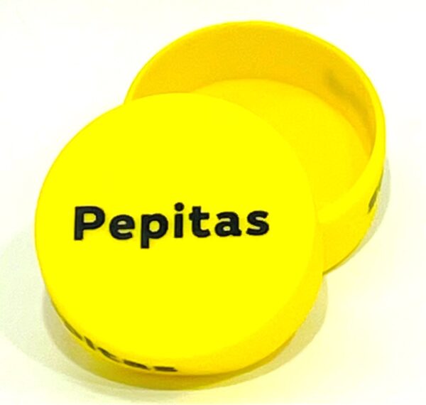 A yellow container with the word pepitas written on it.