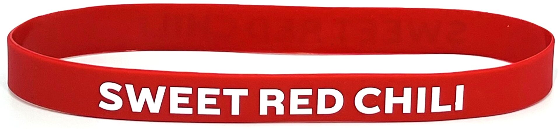 A red rubber bracelet with the words " get redder ".