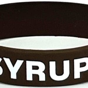 A brown and white bracelet with the word syrup written on it.