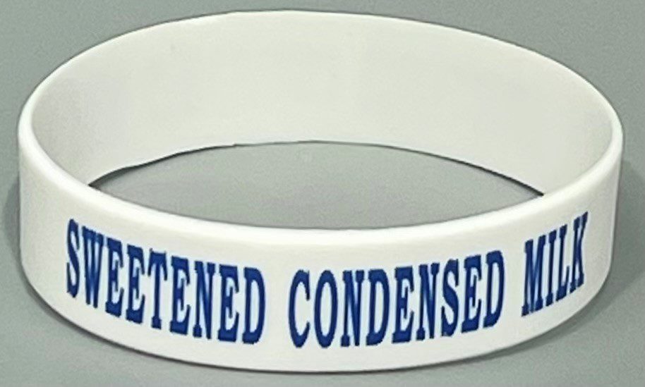 A white bracelet with the words " detened condensed ".