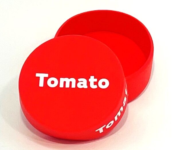 A red box with the word tomato on it.