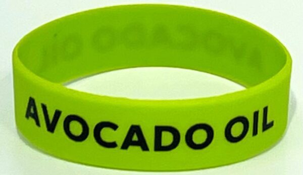 A close up of the wristband with the word " avocado " written on it.