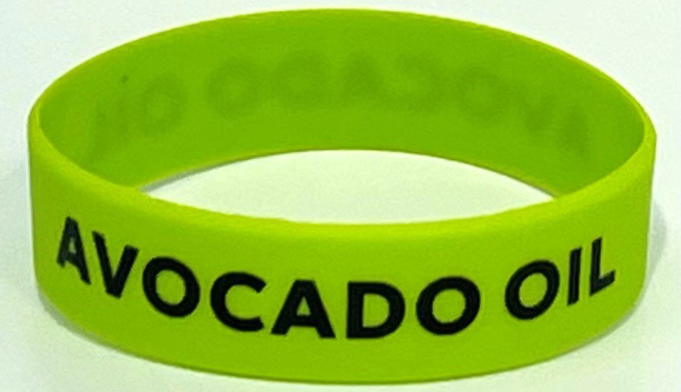 A close up of the wristband with the word " avocado " written on it.