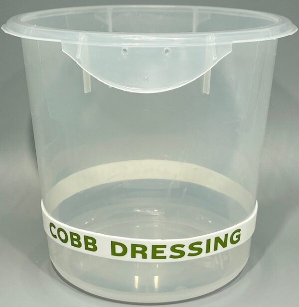 A plastic container with cobb dressing written on it.