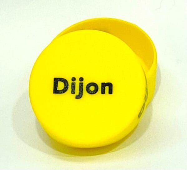 A yellow container with the name dijon on it.