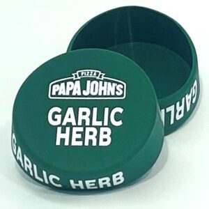 A green container with the words papa john 's garlic herb on it.