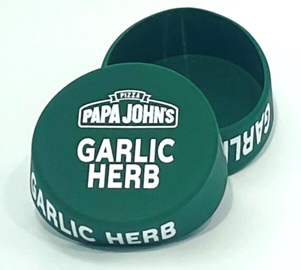 A green container with the words papa john 's garlic herb on it.