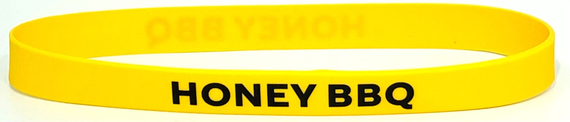 A yellow wristband with the words " money back ".