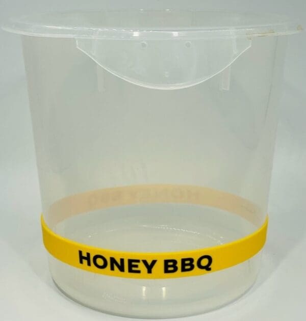 A plastic container with the words honey bbq written on it.