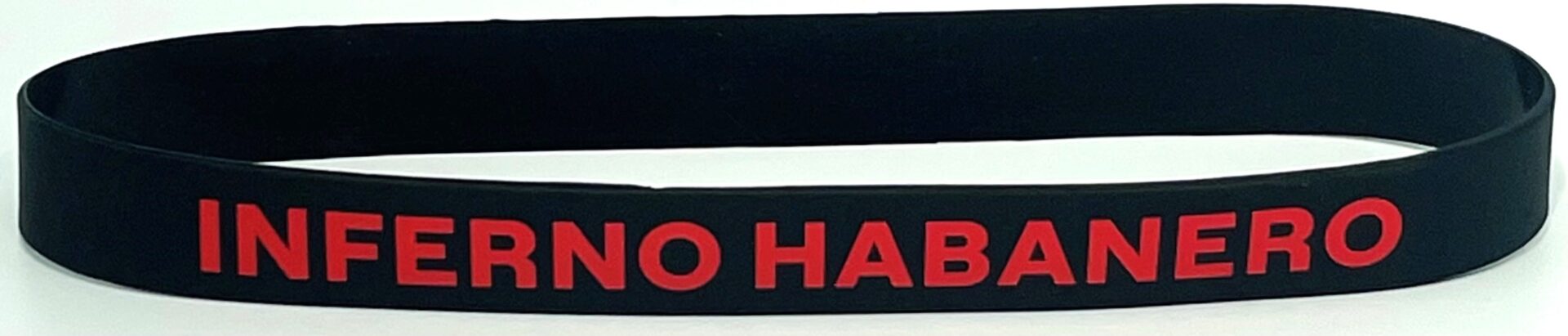 A close up of the side of a no habit wristband