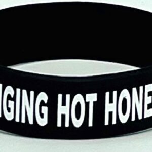 A black and white wristband with the words " banging hot honey ".