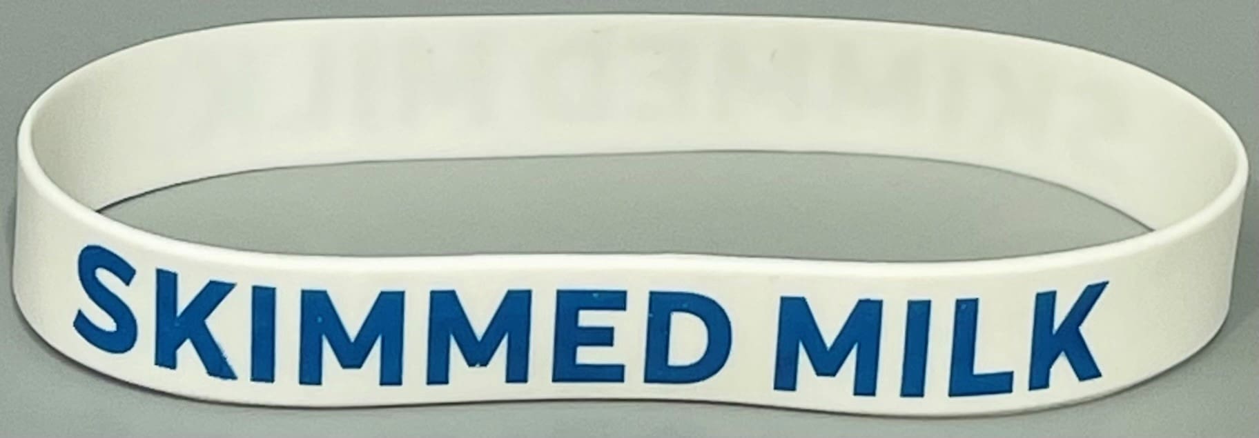 A close up of the medical sign on a band