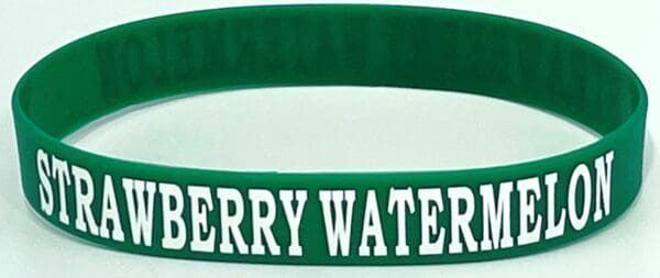 A green wristband with the words " merry water ".