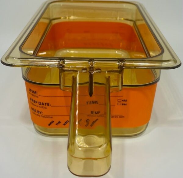 A plastic container with an orange lid and a measuring cup.