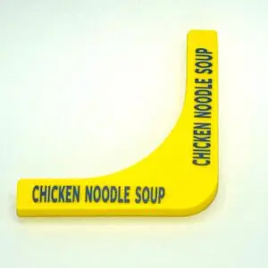 A yellow noodle sign with the words chicken noodle soup written on it.