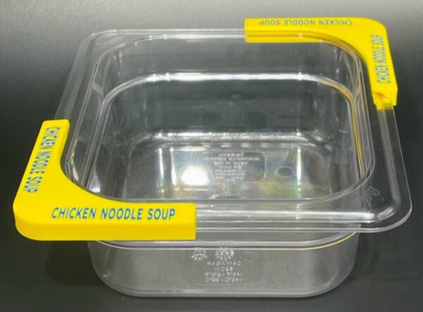 A container with yellow handles and a lid.