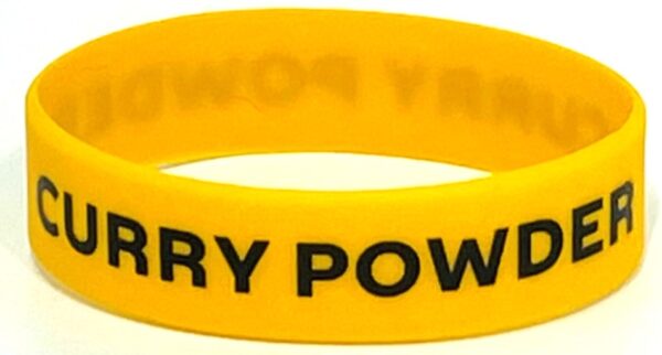 A yellow rubber bracelet with the words " fury power ".