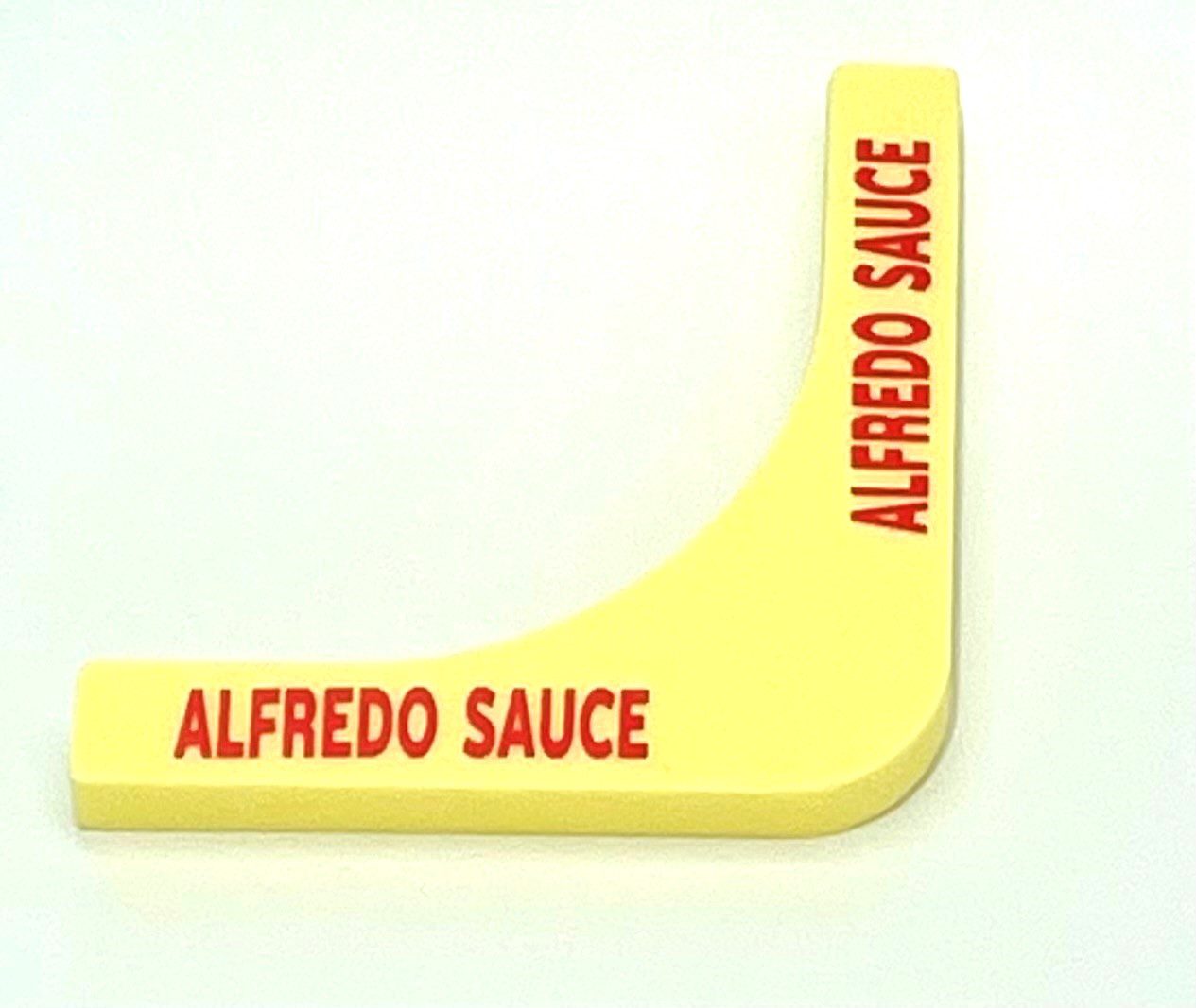 A yellow sign with the name alfredo sauce written on it.