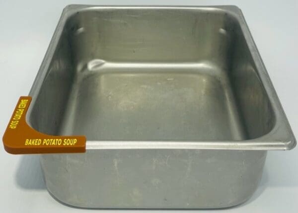 A metal pan with the lid up.