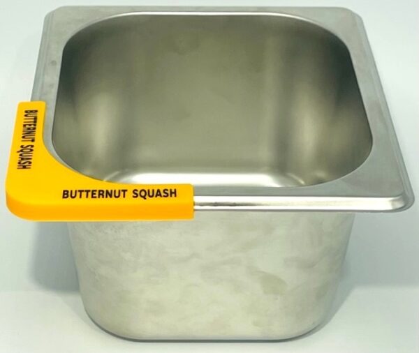 A metal bowl with a yellow label on it.