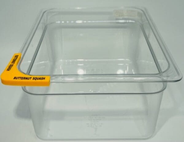 A clear container with yellow label on it.