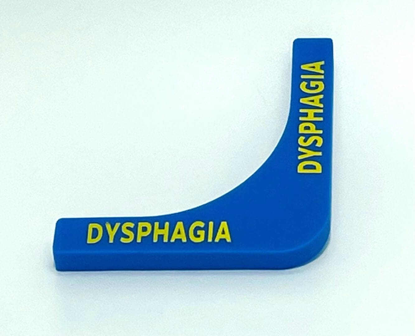 A blue and yellow plastic object with the word dysphagia written on it.