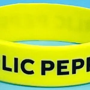 A yellow bracelet with the words public peperoni written on it.