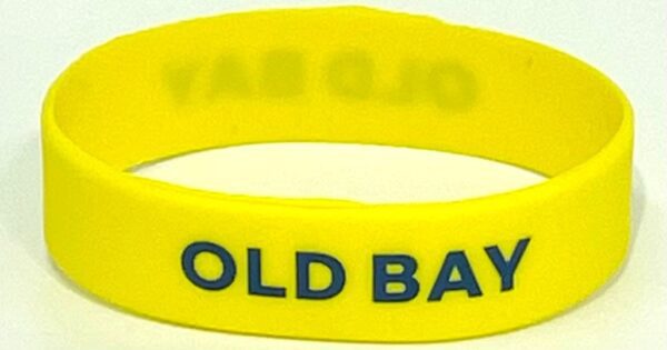 A yellow wristband with the words " old bay ".