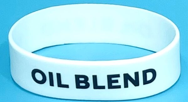 A white bracelet with the words oil blend on it.