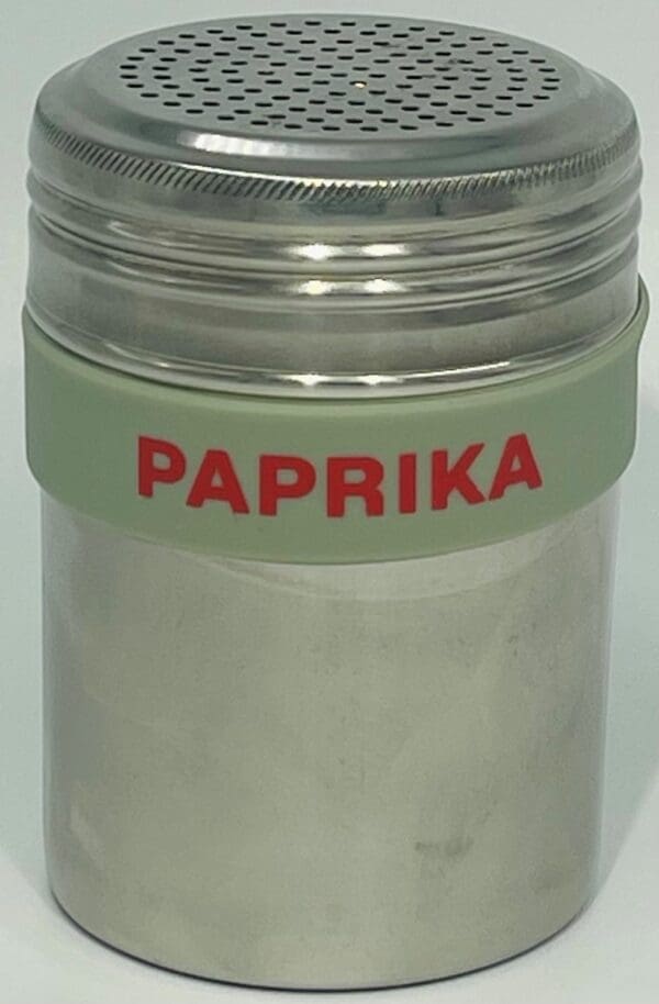 A jar of spices with the name paprika written on it.