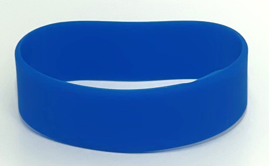 A blue bracelet is shown on top of the table.